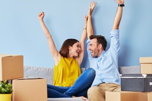 A couple celebrates moving into a new apartment. S&S Property Management offers apartments for rent in Peoria IL.